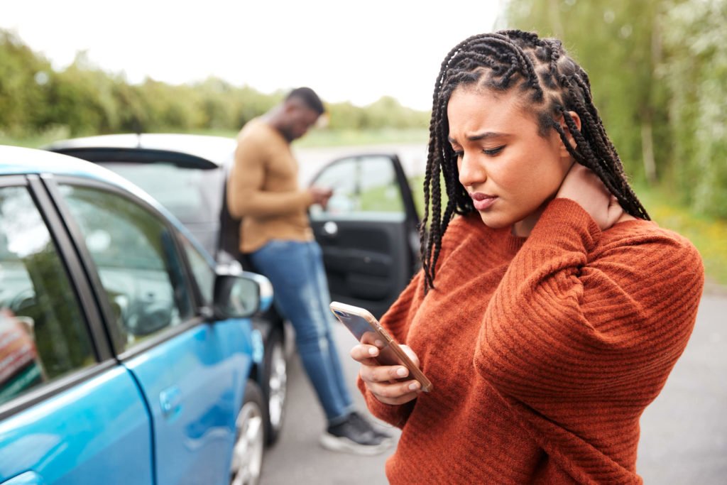 woman-inured-on-phone-in-car-accident